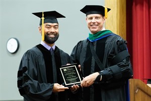 Doctor of Chiropractic program graduate Michael Abenoja and Daniel Strauss, DC